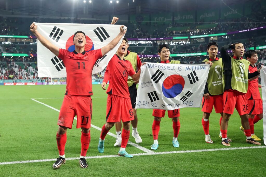 Korea Republic players celebrate after defeating Portugal and moving to the knockout stage of the  FIFA World Cup 2022 at Education City Stadium in Al Rayyan, Qatar, on Dec. 2.Photographer: Alex Grimm/Getty Images