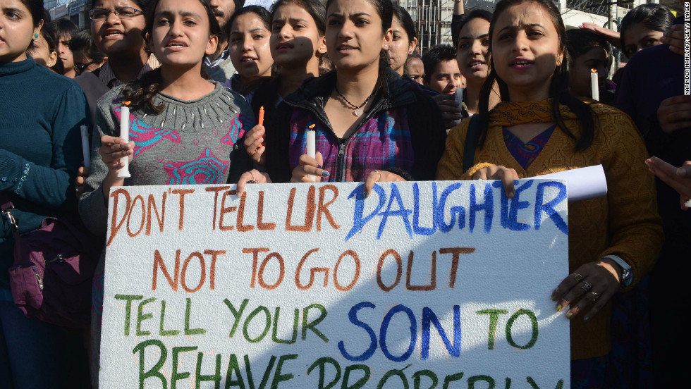 Crowd of South Asian women protesting with the sigh that says, "Don't tell your daughter not to go out, tell your son to behave properly"