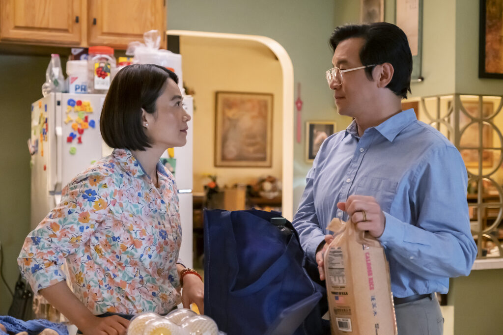 Jin's parents have a conversation in the kitchen. 