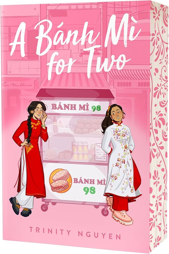 "A Bánh Mì for Two" by Trinity Nguyen
Playful pink illustrated cover showing two Vietnamese girls in áo dài standing beside a bánh mì cart labeled “Bánh Mì 98.” The title “A Bánh Mì for Two” is written in white, handwritten-style text at the top.