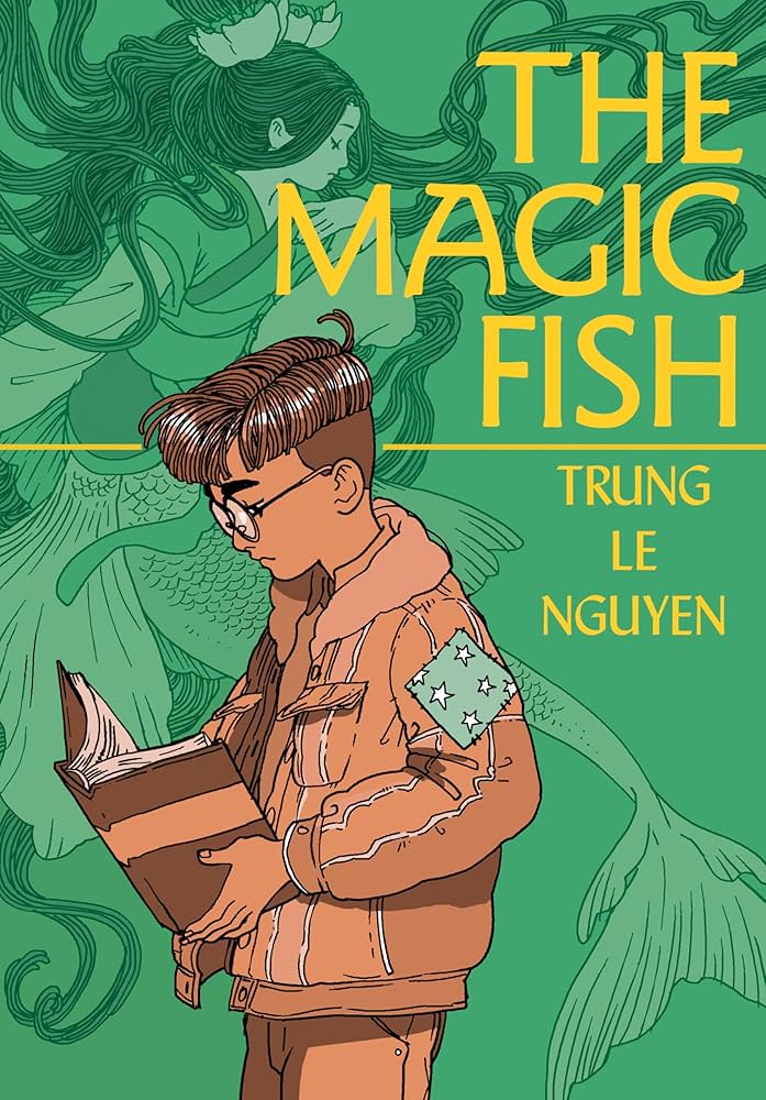 "The Magic Fish" by Trung Le Nguyen
Green illustrated cover showing a boy reading a book while ethereal figures, including a mermaid, float in the background. The title “The Magic Fish” appears in bold yellow text, and the author’s name is in the same font below.