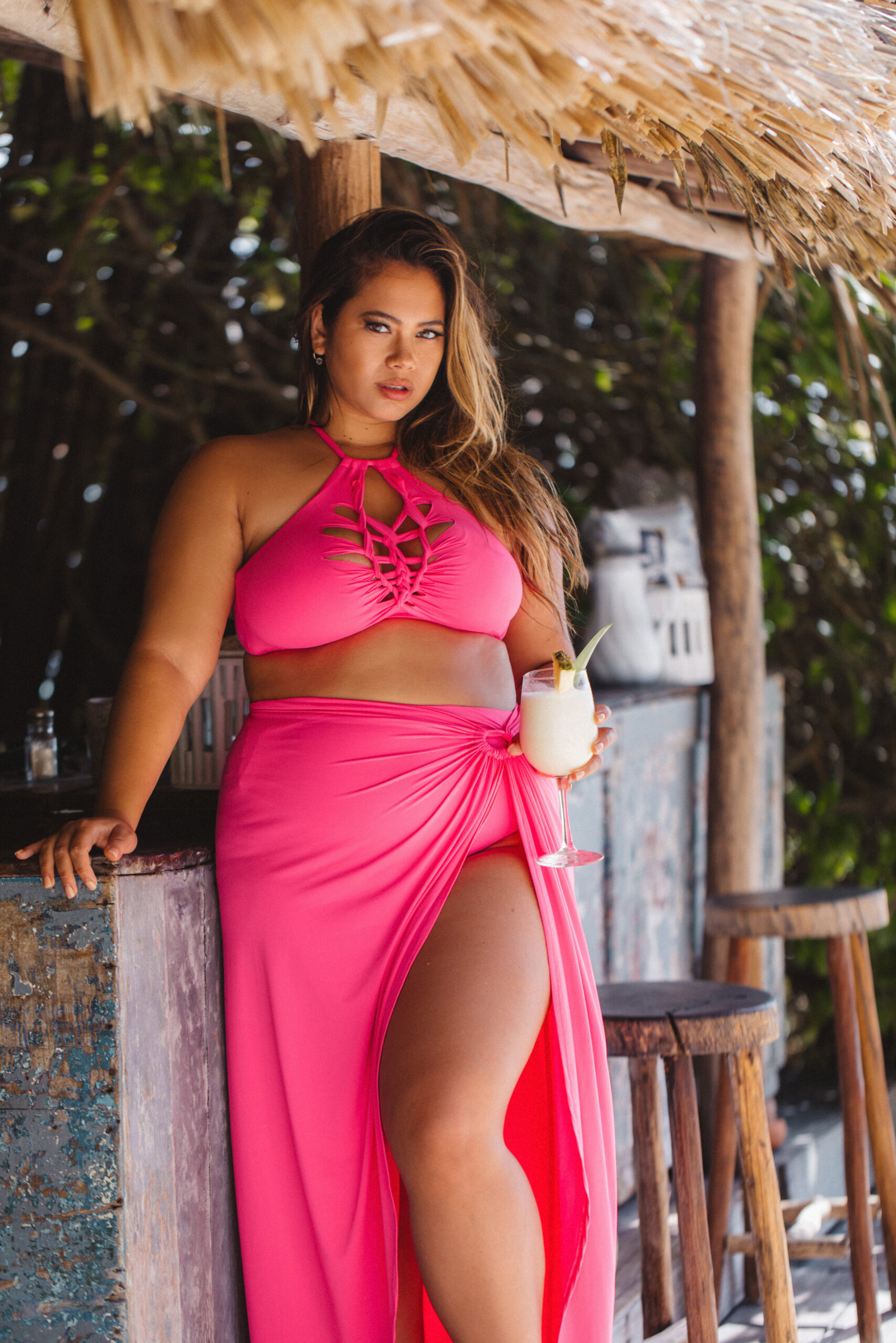 Catherine Li takes a photo shoot in a pink bikini. Her brand advocates body positivity.  