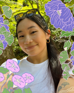 Chinese Canadian artist Artist Paige Jung in a close-up photo. Her black hair is tied up with glasses on her head, and a smile on her face. Around her are trees and illustrations of green and purple flowers.