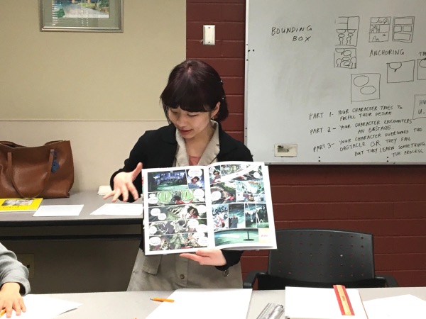 Janice Liu explains a comic to her students