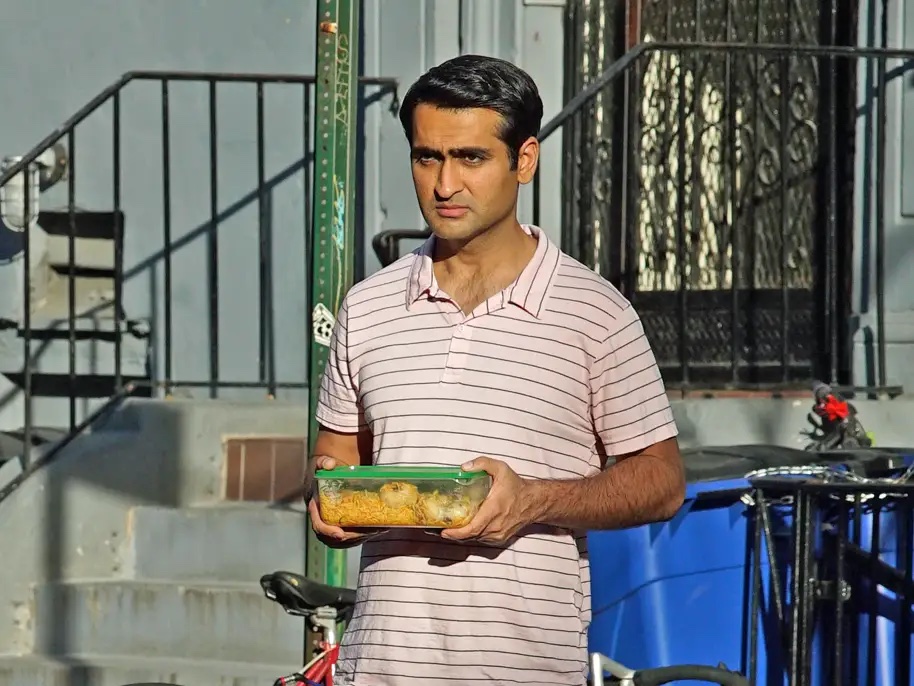 The Big Sick still with Kumail holding a container of Biryani 