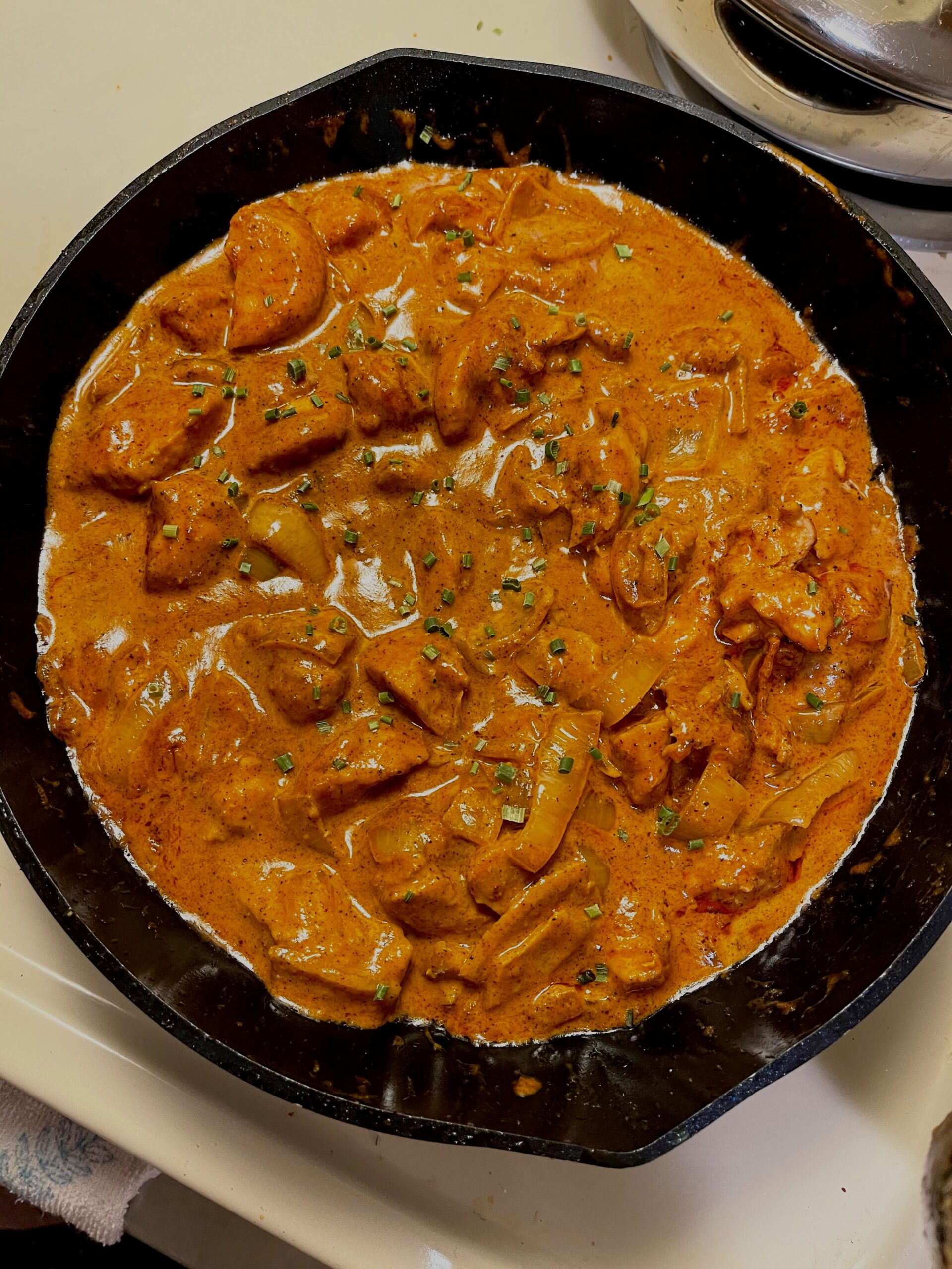 Butter chicken, a South Asian and Pakistani food passed down through the author's family.