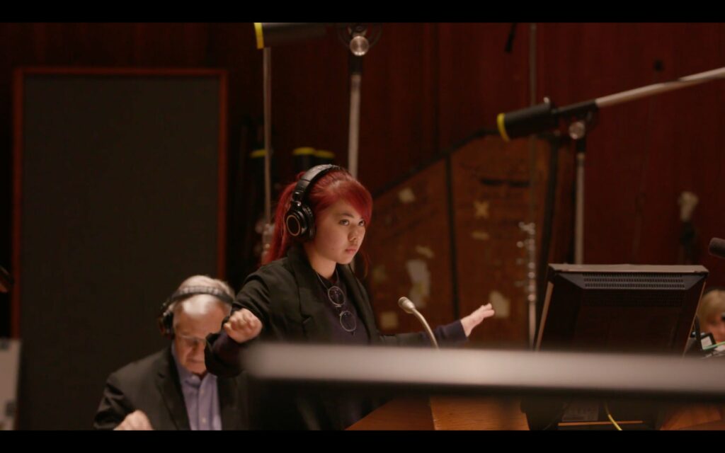 Film composer Jaimie Pangan conducting at Warner Brothers