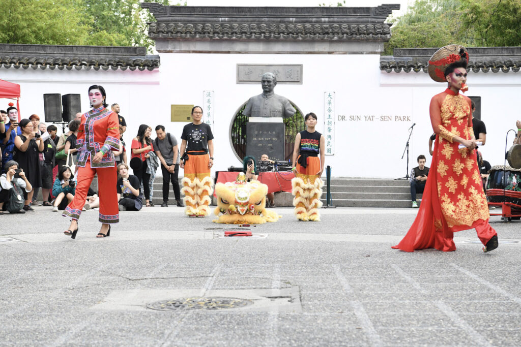 Dora Ng stands for the ceremony for Pride in Vancouver's Chinatown before the lion dance