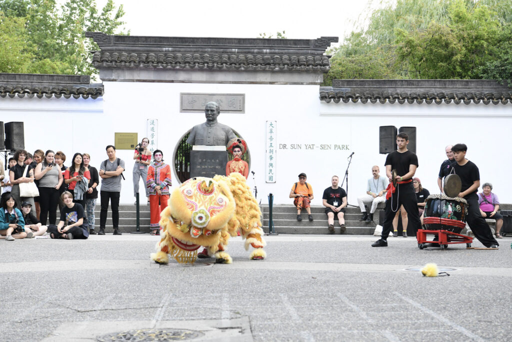 The lion crouches low during the lion dance for Pride in Vancouver's Chinatown