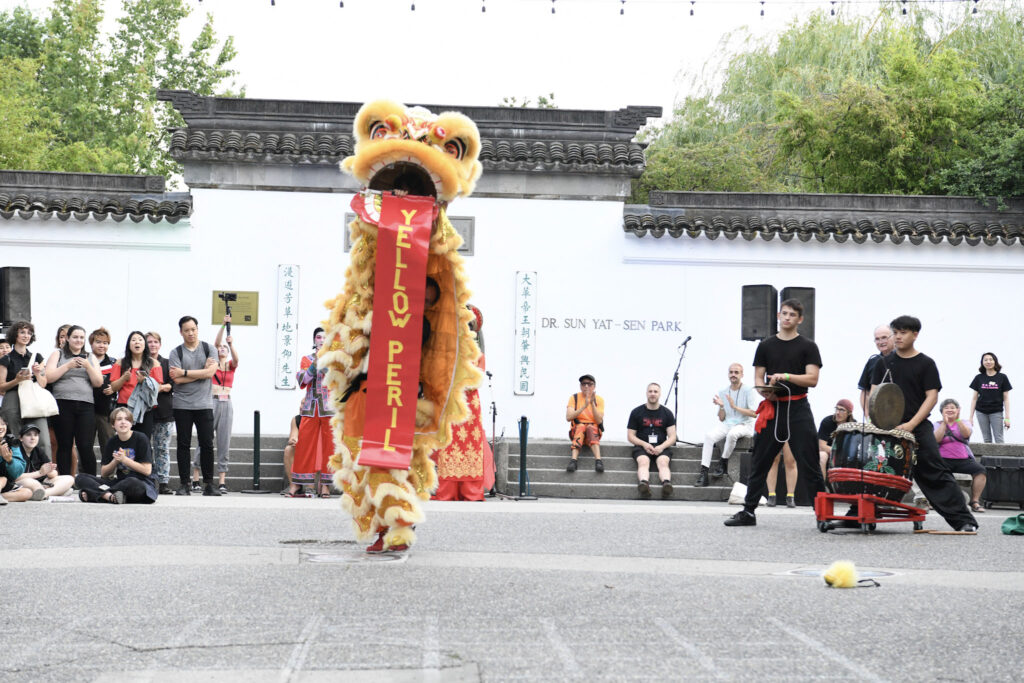 The lion stands tall during the lion dance for Pride in Vancouver's Chinatown