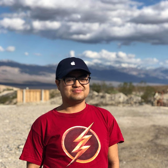 Dennis outdoor in red flash t shirt and apple hat