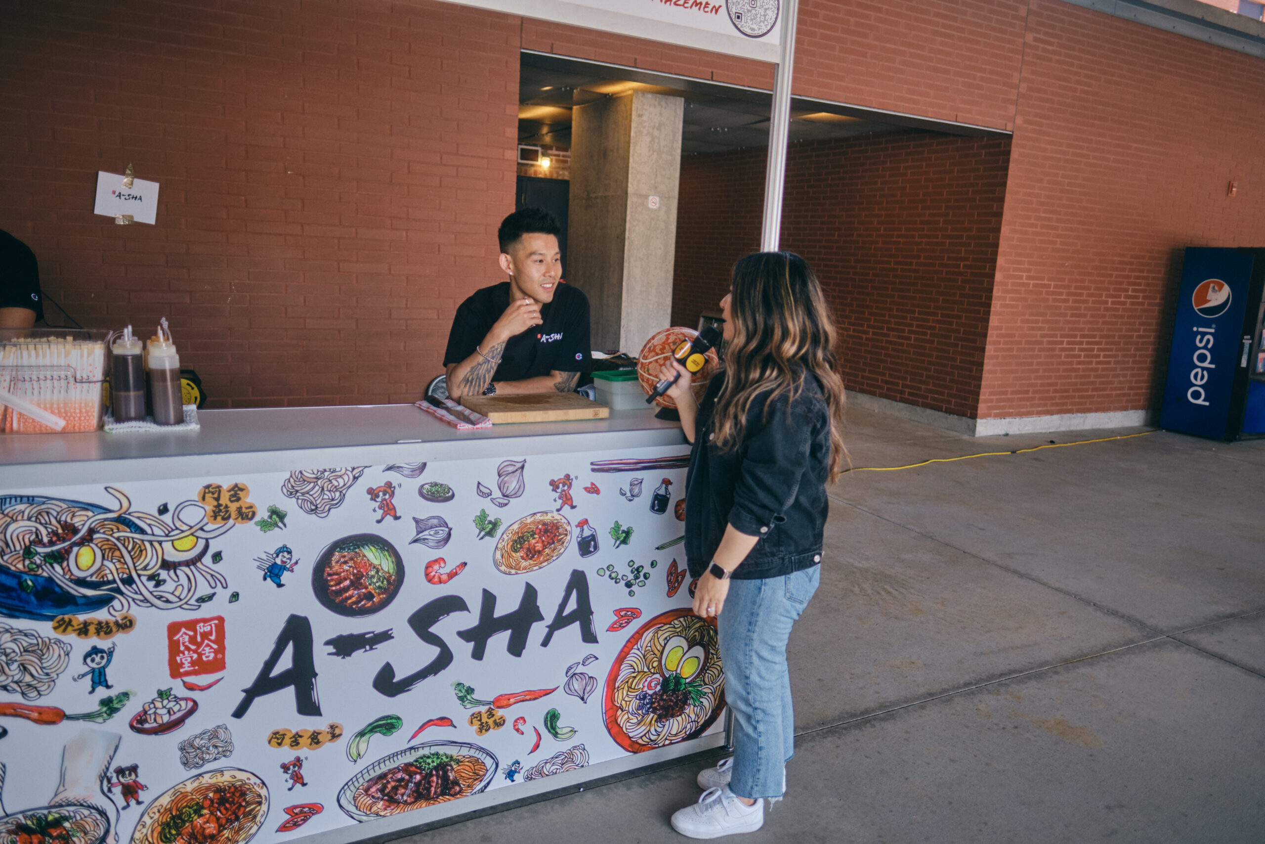 Chef Wallace Wong at the A-Sha booth during an interview with Natasha Jung