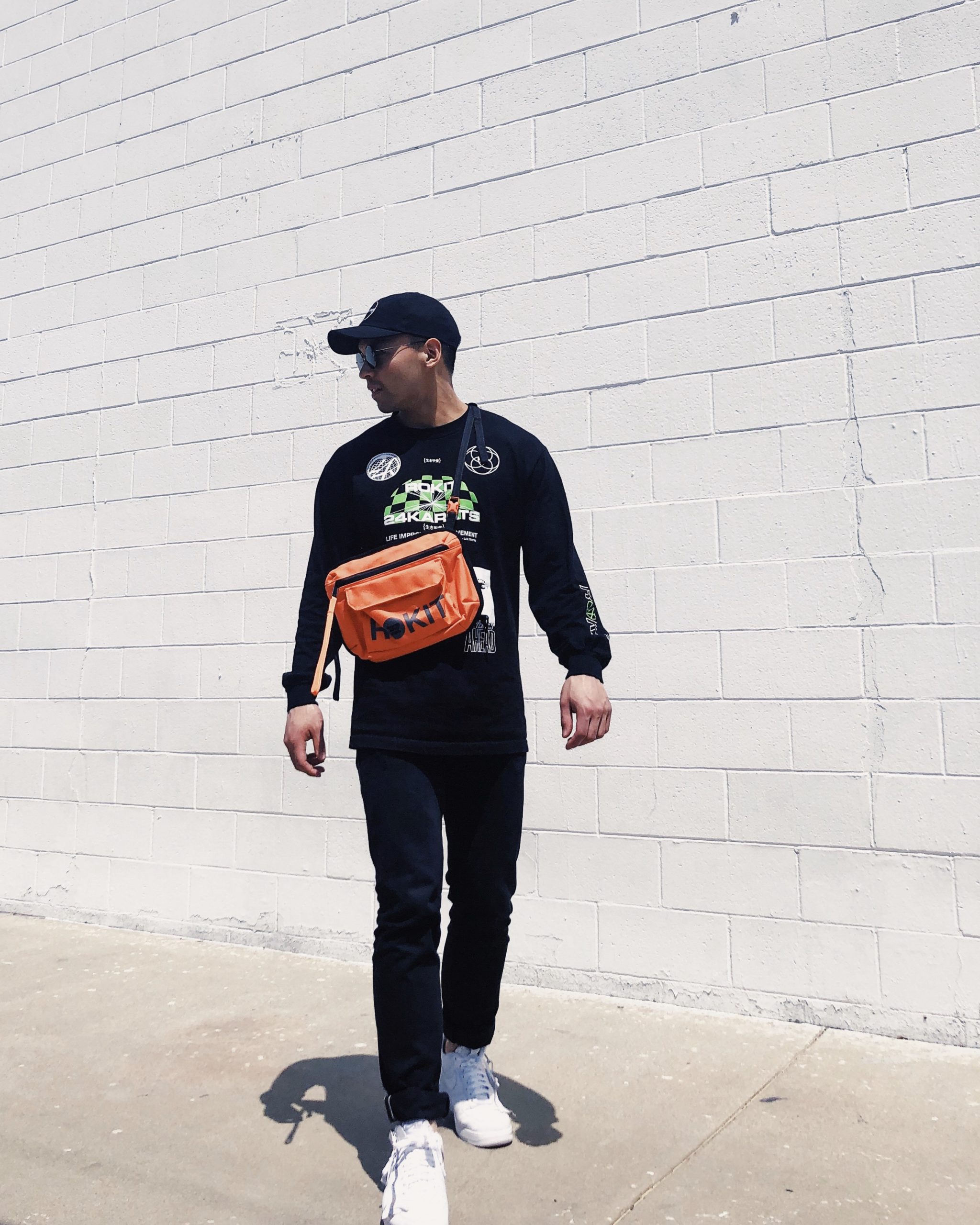 Michael Africa dressing in Herschel items as fashion pieces.