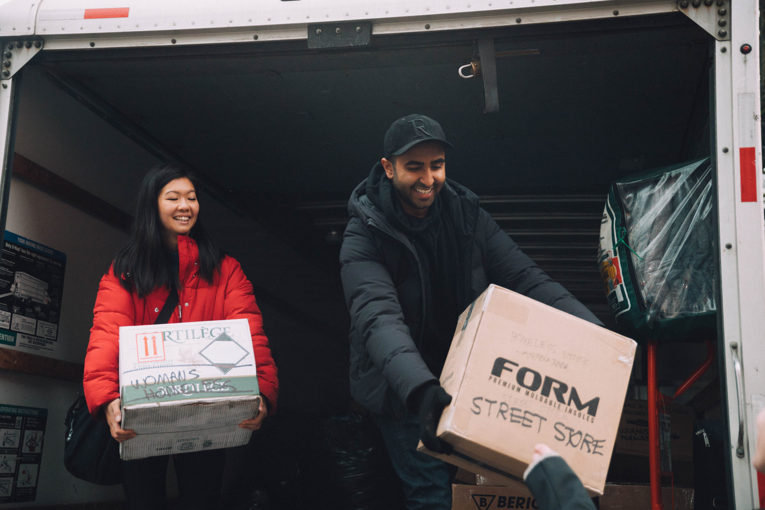 Unloading boxes of clothes for people facing homelessness at the Vancouver Street Store 