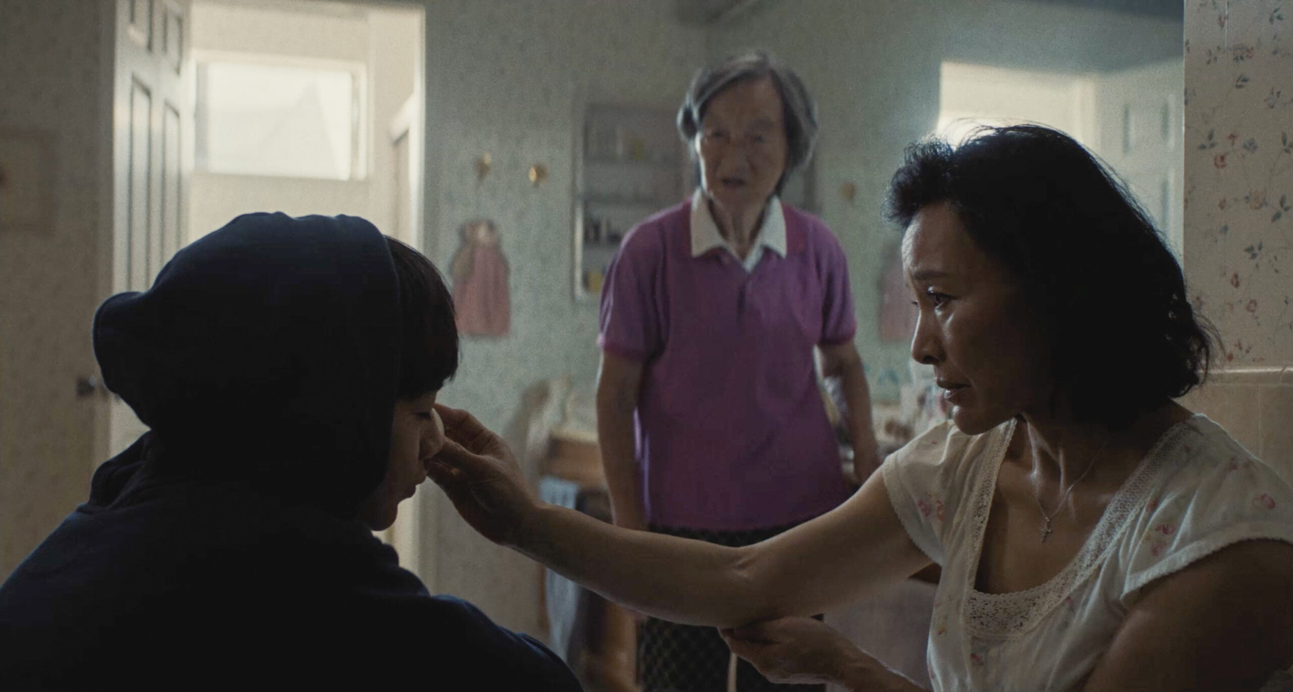 (L to R) Izaac Wang as "Chris Wang", Chang Li Hua as "Nai Nai" and Joan Chen as "Chungsing Wang" in DÌDI