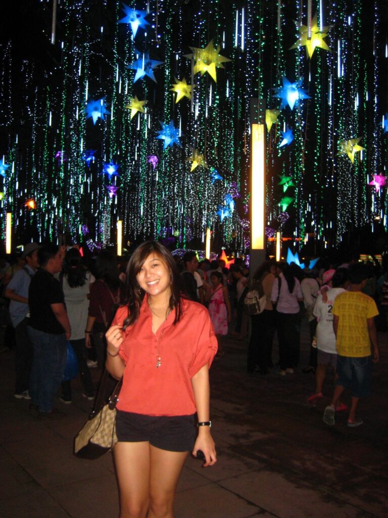 Karra Barron surrounded by parols in the Philippines.