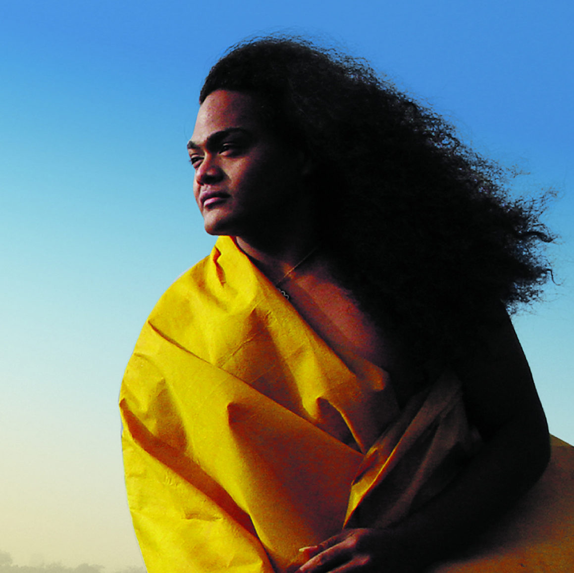 Singer Kaumakaiwa Kanakaʻole posing for a photo.