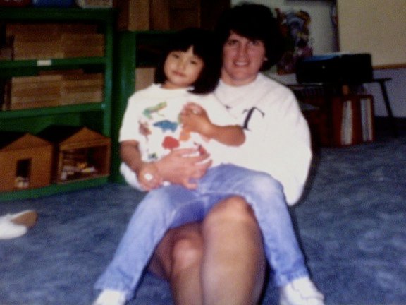 An Asian girl with her mother, a white woman. 