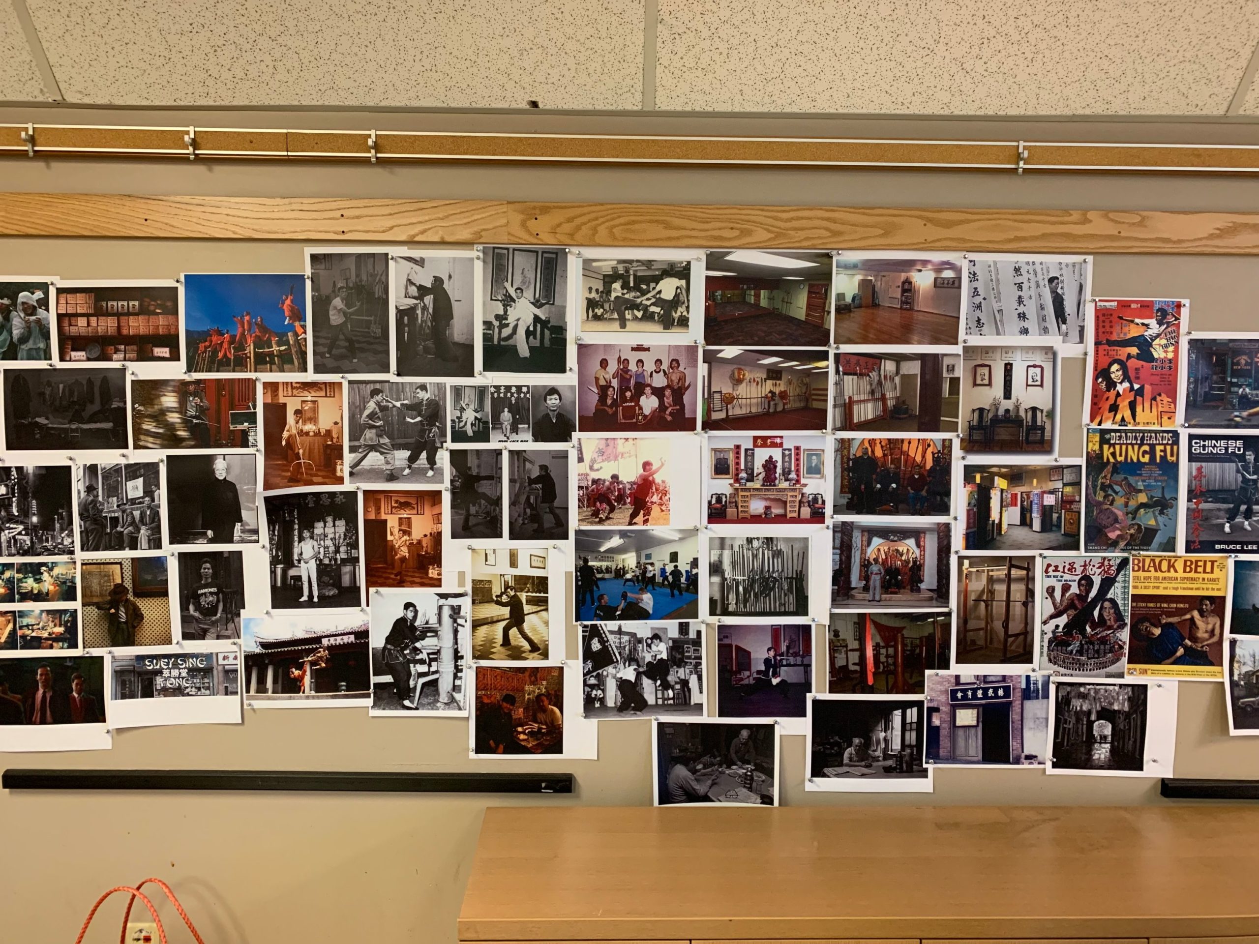 Wall of reference photos for the kung fu school in The Paper Tigers film