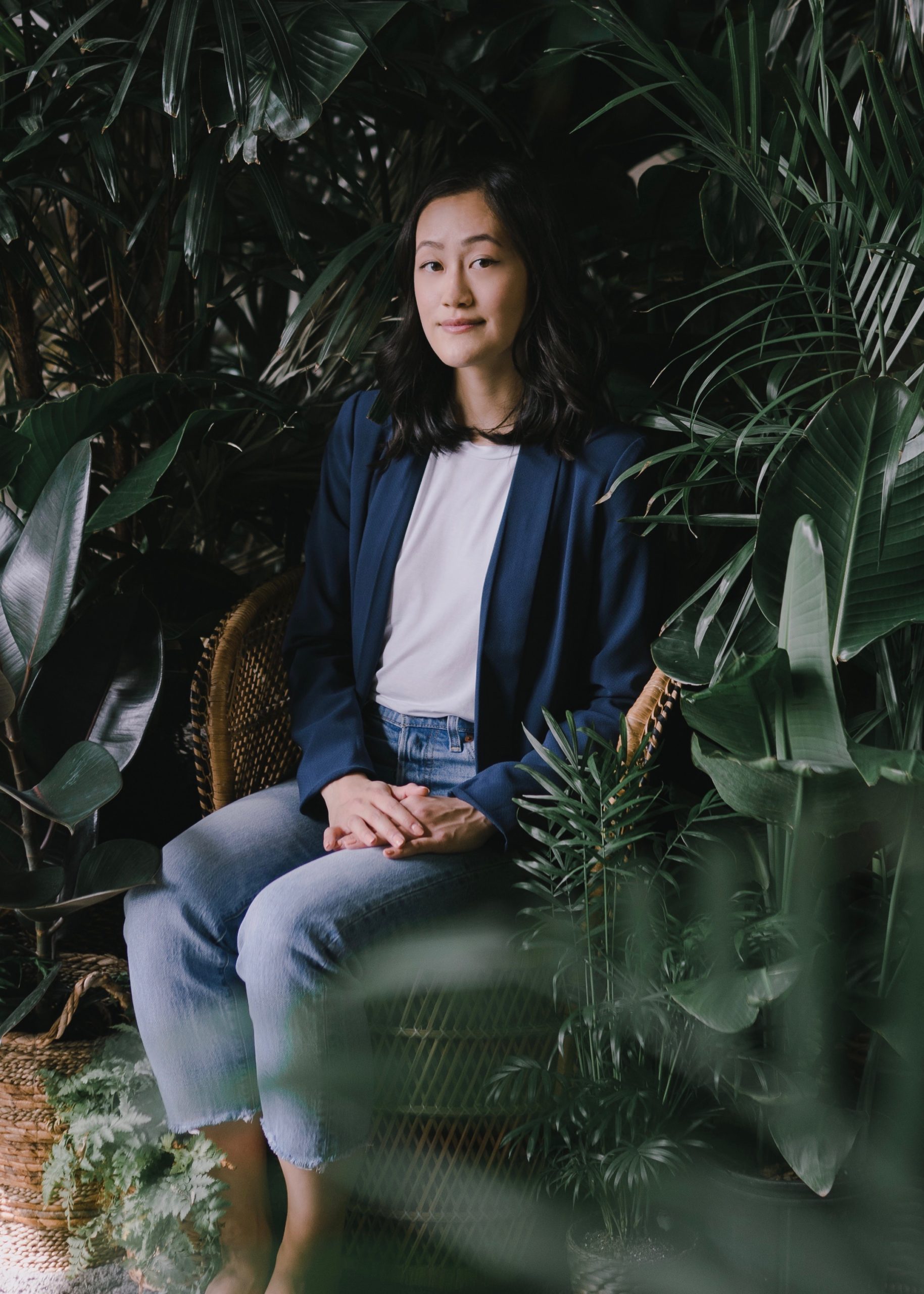 Recloseted founder Selina Ho seated among plants