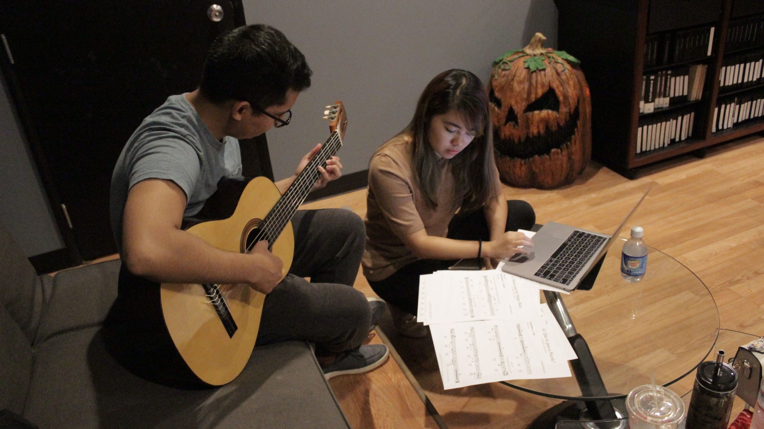 Film composer Jaimie Pangan working in the studio with her guitarist