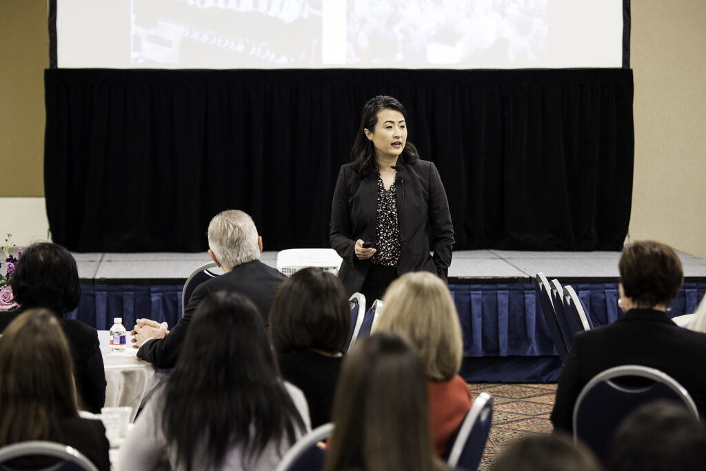 Jane Hyun presenting to a group of listeners about the "bamboo ceiling"