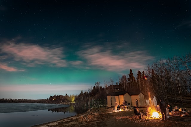 People camping outside in Northern Canada, the picture has no relation to the article itself. 