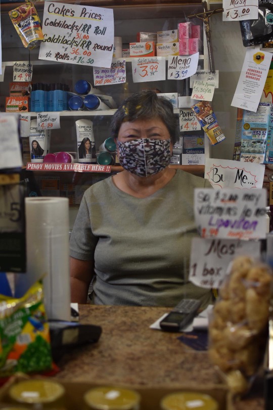 McNabb smiling behind the counter.