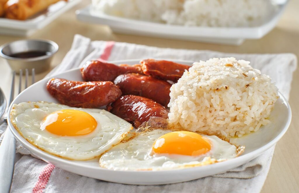 Longsilog, a traditional Filipino dish that's served for breakfast, on a dinner table.