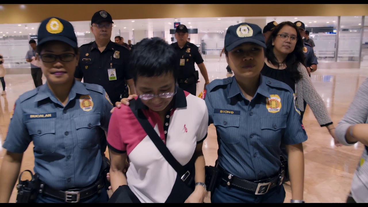 Screenshot from A Thousand Cuts by Ramona Diaz as Ressa is arrested in the Philippines.