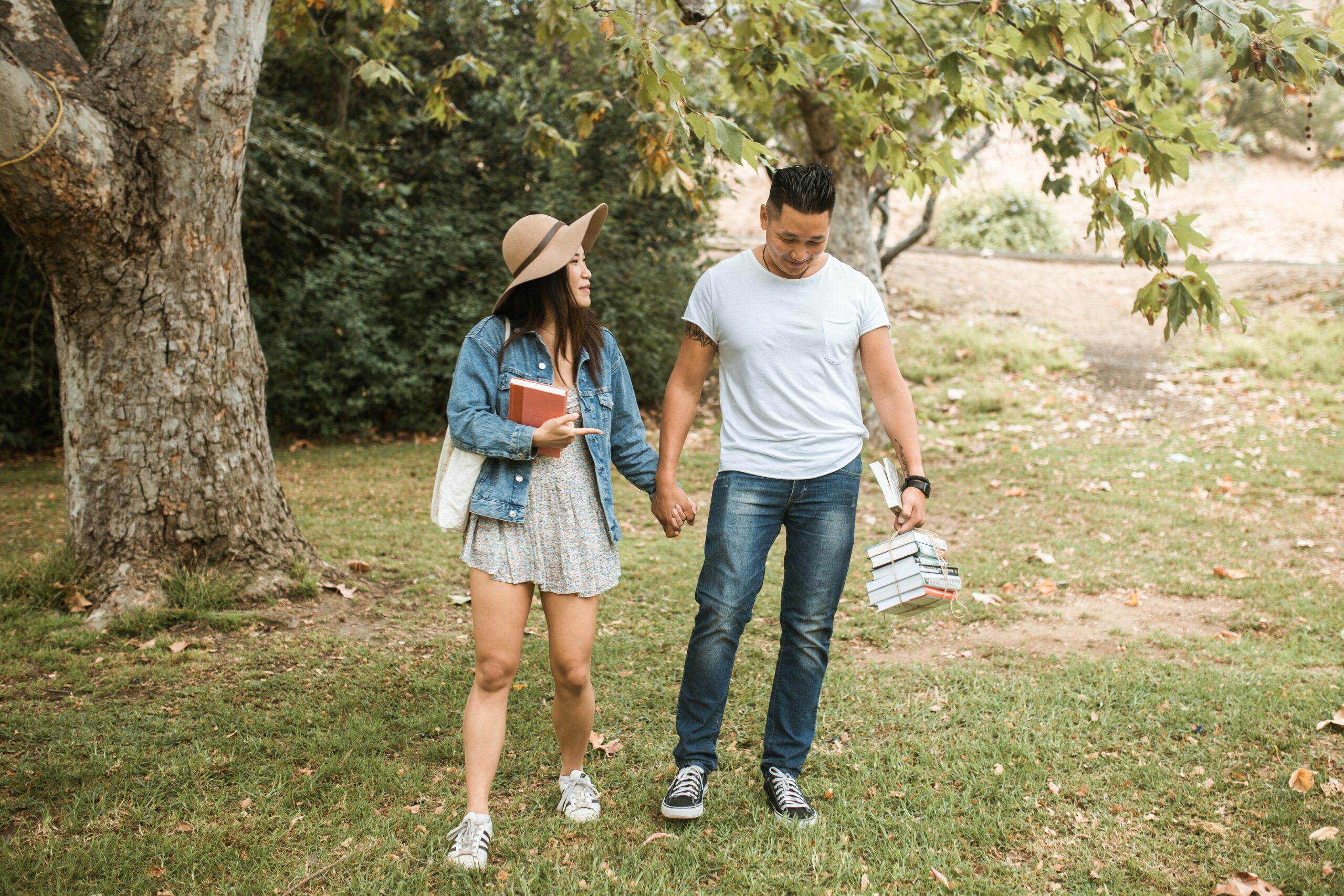 couple holding hands picnic