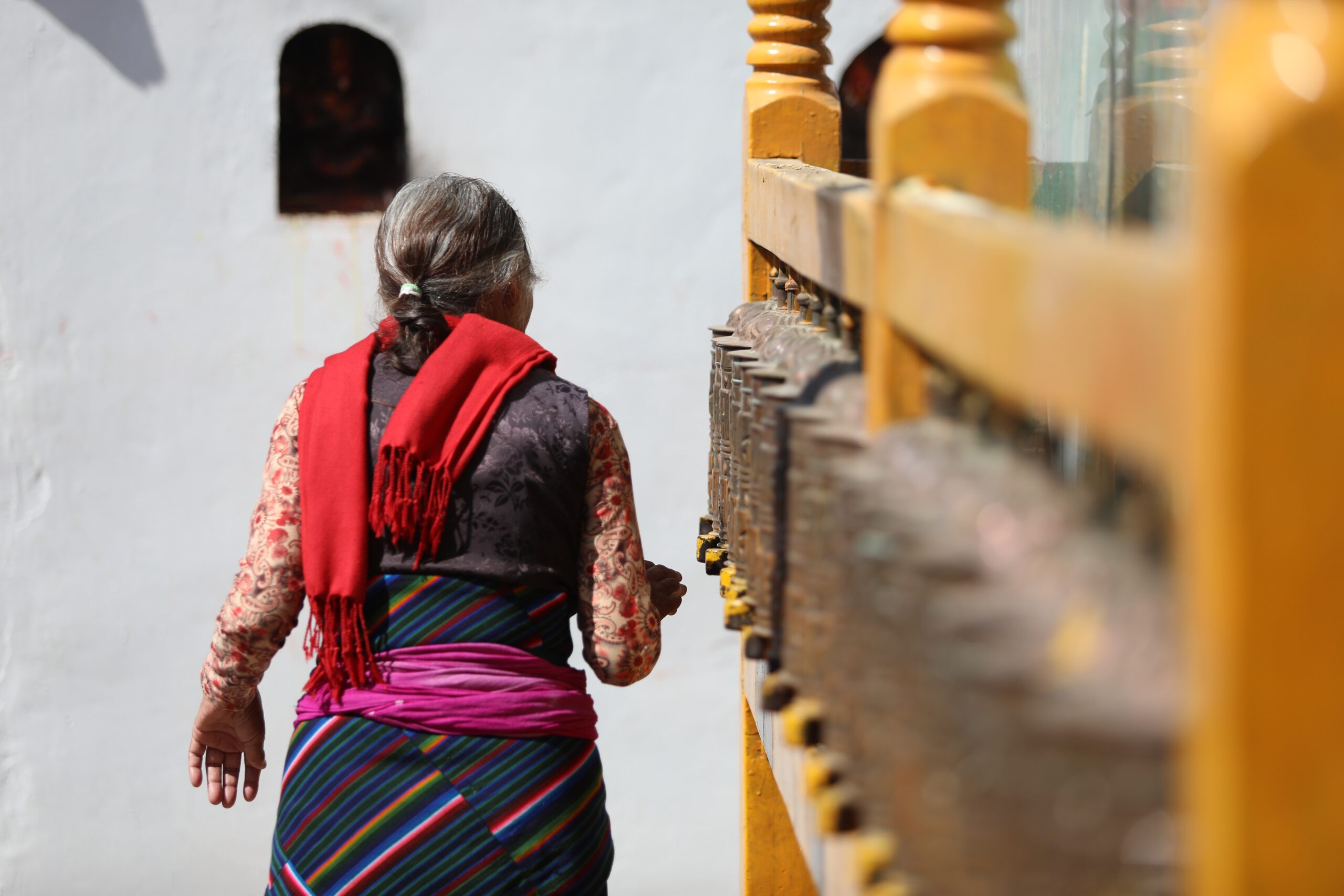 Elderly woman at a temple.