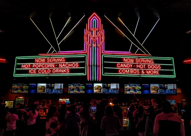Movie theater concession stand with neon lights. 