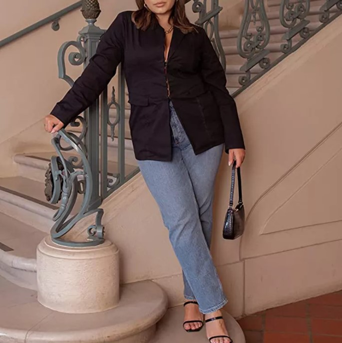 A photo of Catherine Li modeling clothing. The focus is on the clothing she wears and her face is only partially visible. 