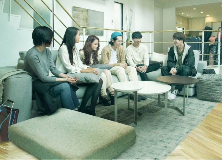 Cast members of TV show Terrace House sitting on couch