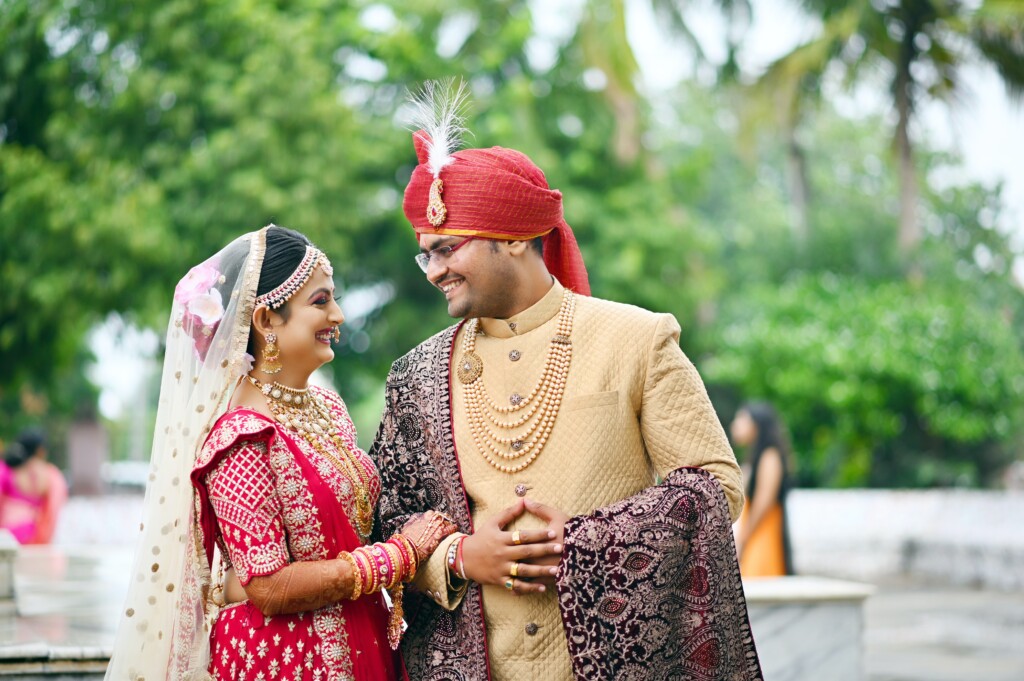 Bride and groom wearing traditional indian wedding attire